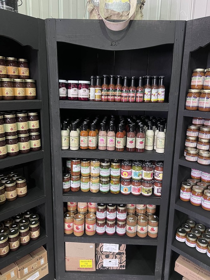 Shelves of apple butter, cider, salsas and other dry goods at The Apple Barn